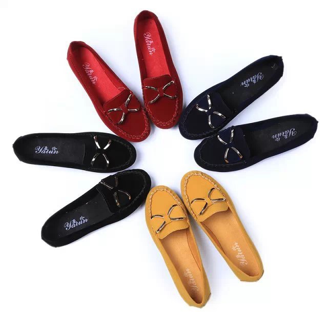 Collection of flat loafers in various colors arranged in a circle